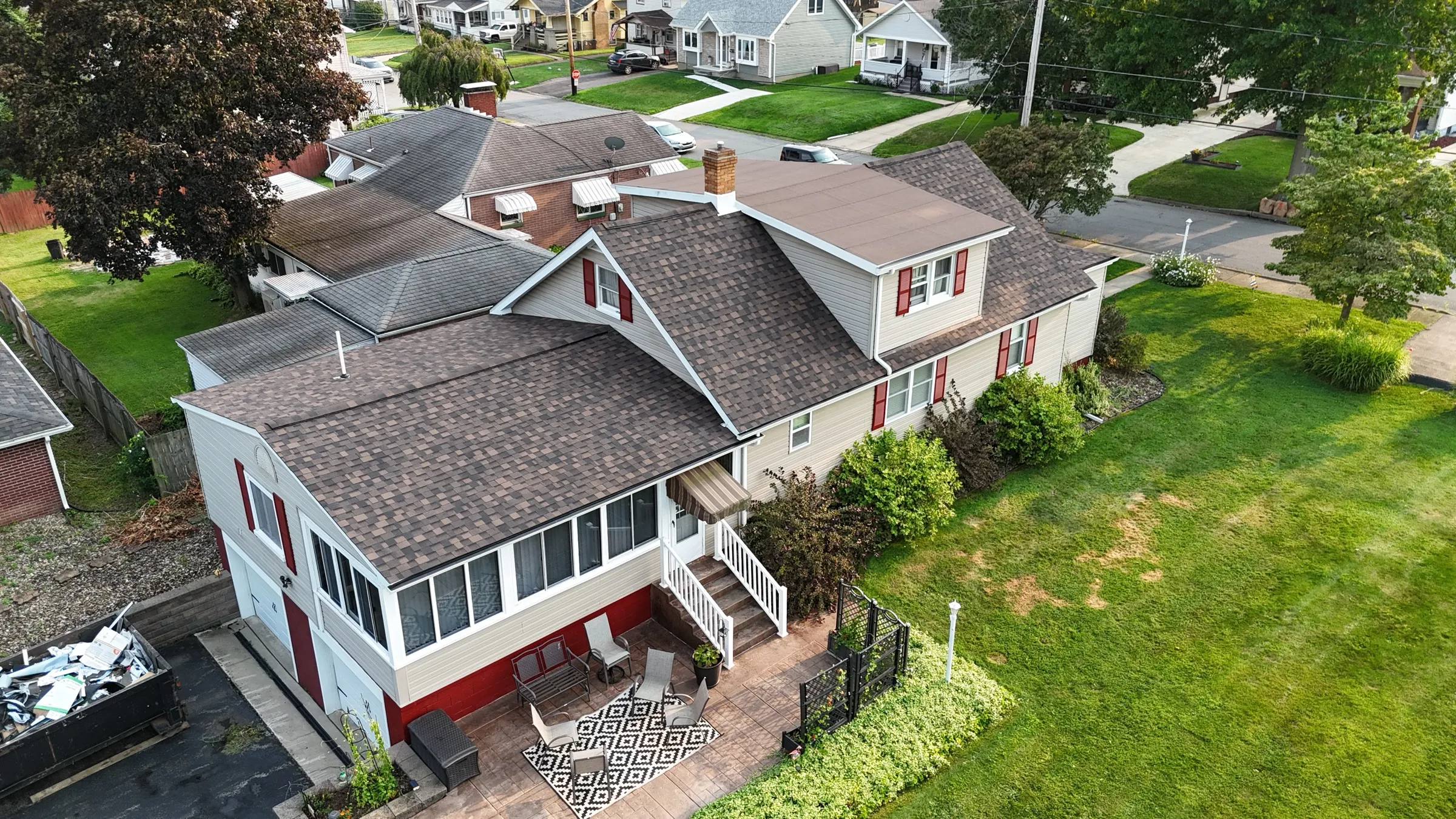 Home with sunroom after C. Kalcevic Roofing completed the work